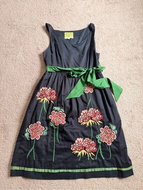 Floreat Black Garment with Yellow Floral Label